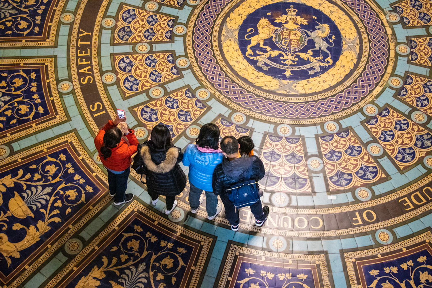 A family looks at the vestibule floor.