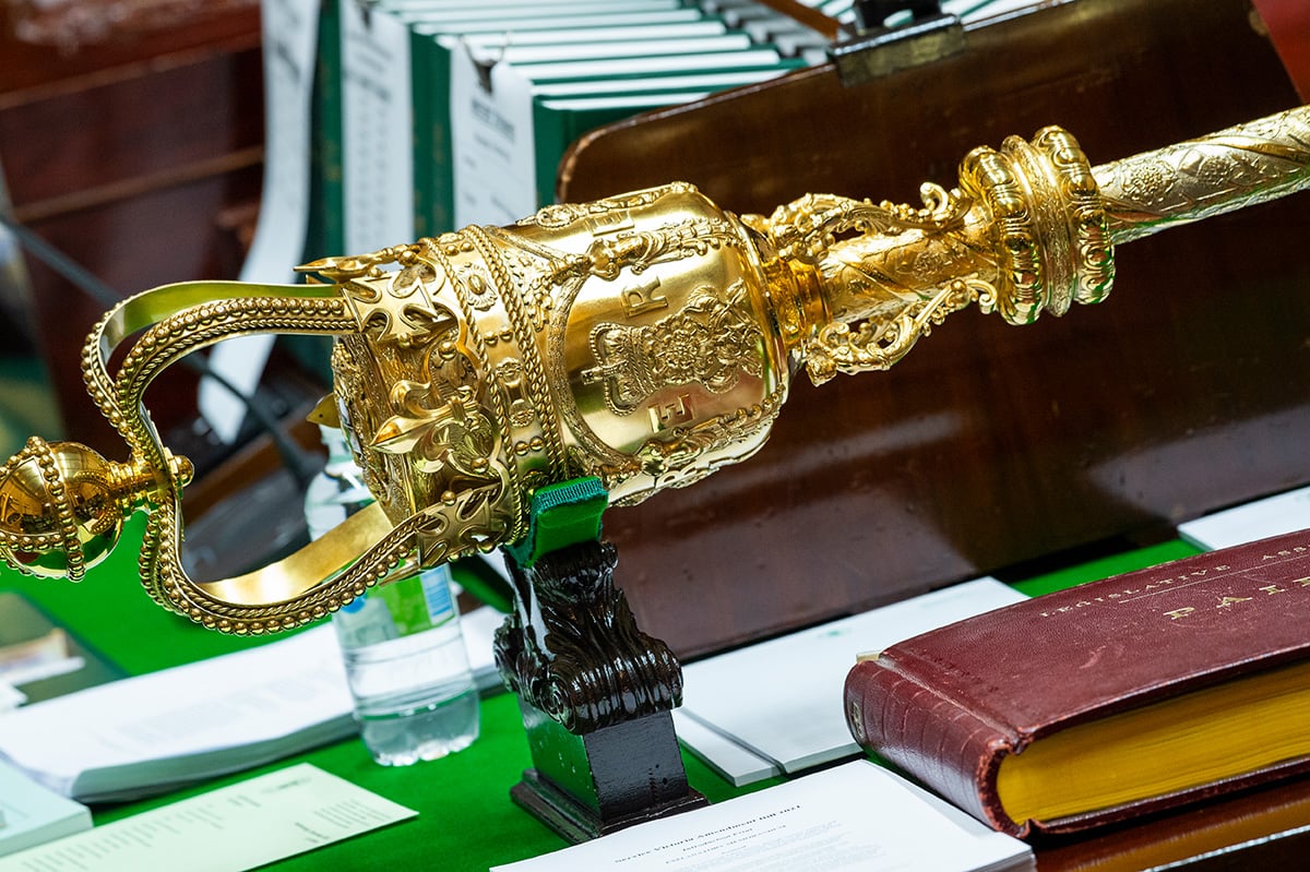 The mace on the table of the Legislative Assembly chamber.