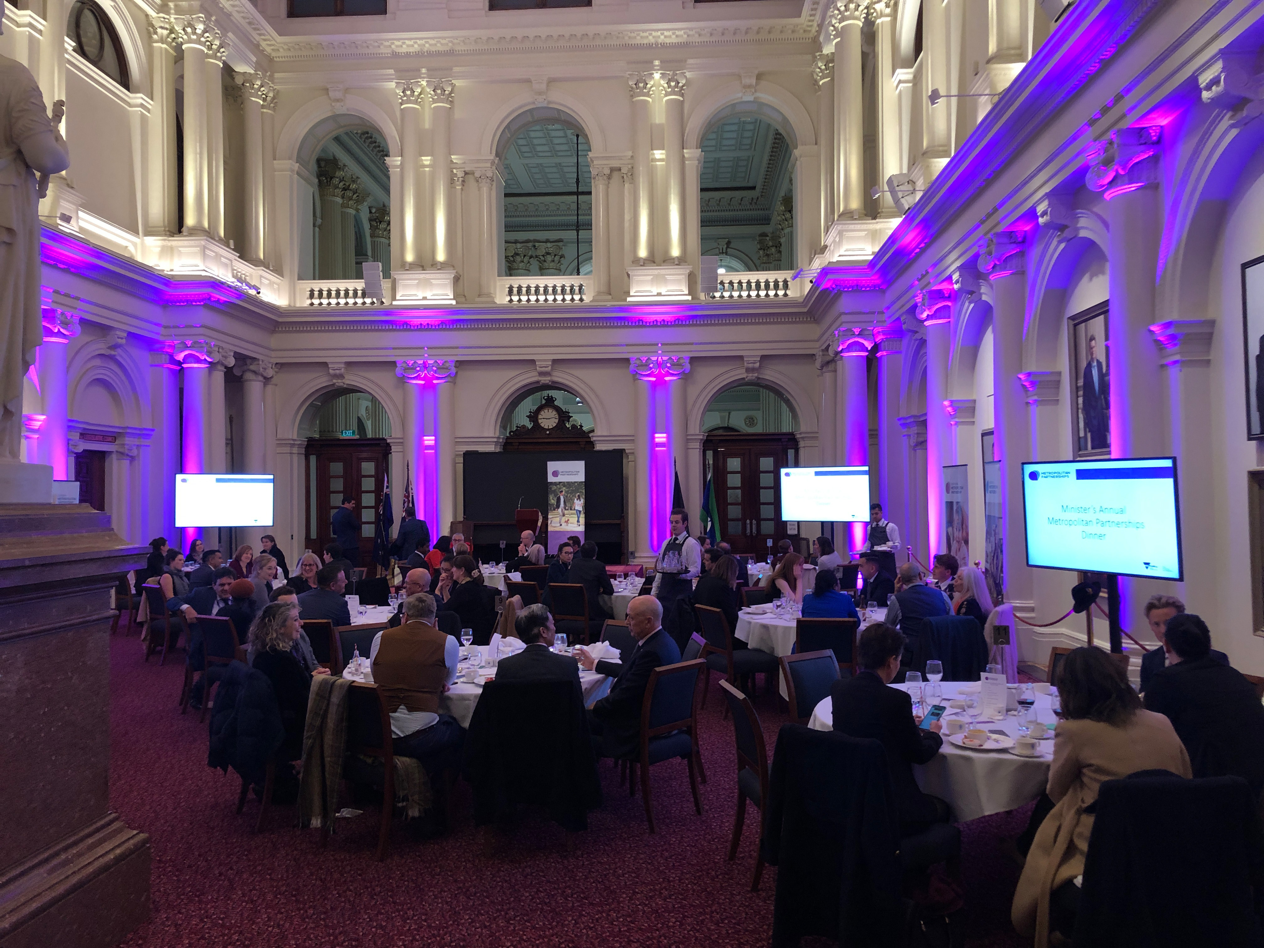 Queen's Hall filled with tables and chairs, ready for an event.