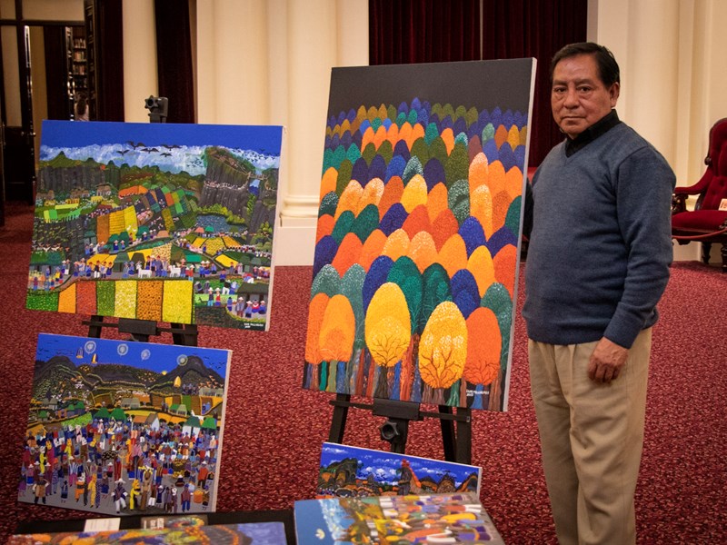 Luis Millingalli  displaying his art from Ecuador in Queen's Hall.