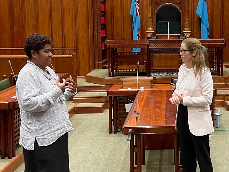 Fiji Parliament's media officer Bale Dolokoto in discussions with Sally West, the Victorian Parliament's twinning program coordinator.