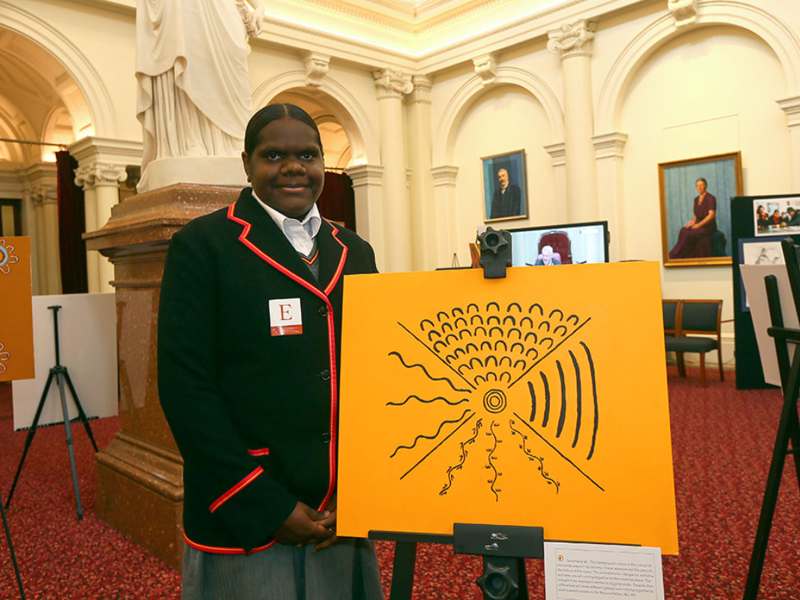 Worawa student Seramayla with her artwork depicting a meeting place. Photo: David Callow
