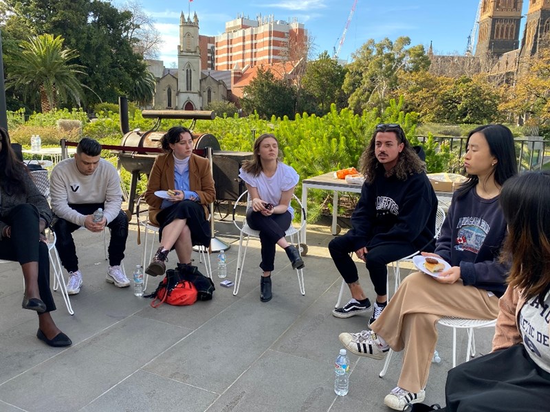 Group of young Victorians discussing themes and topics for a video series about parliament.