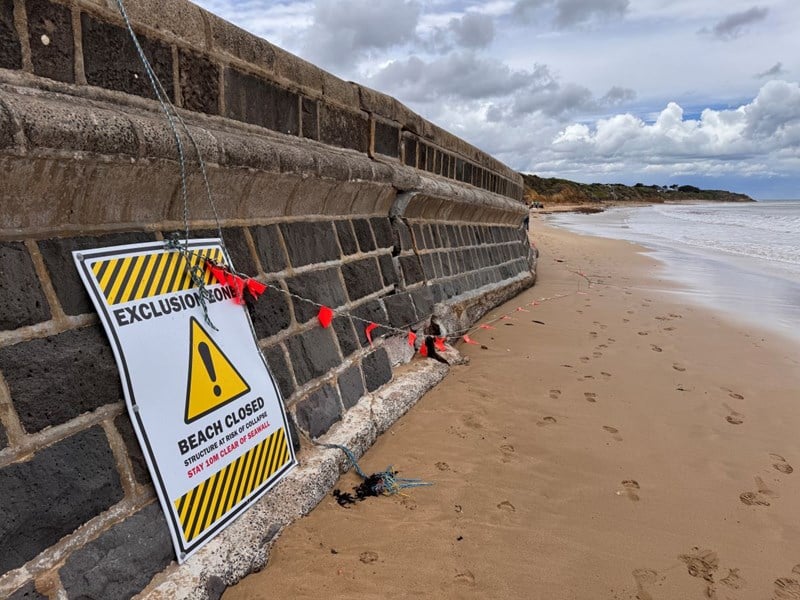 Damage caused to the sea wall at Torquay beach by high tides.